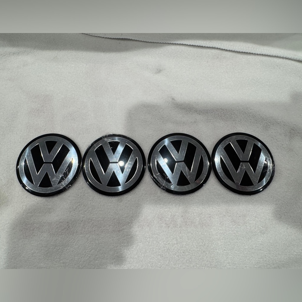 Four VW Volkswagen center cap emblems 56mm in diameter brand new